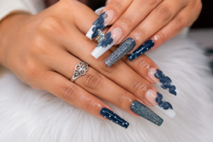 Blue acrylic nail design by E&C Nail Arts in Houston
